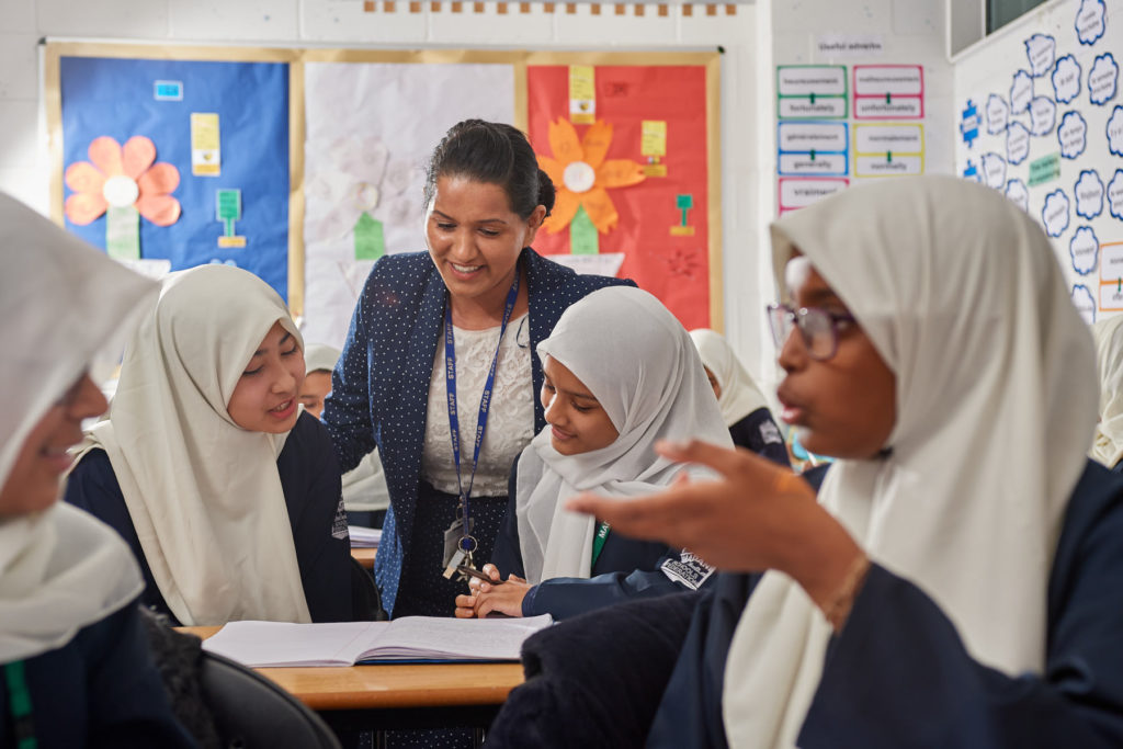 students in a classroom talking